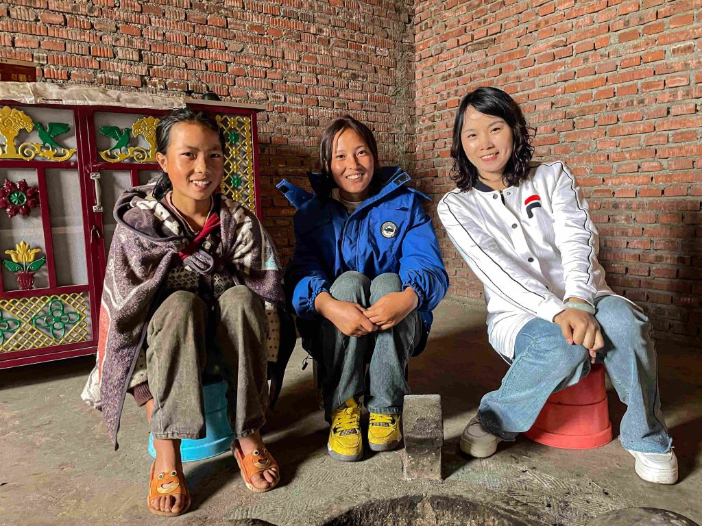 Country manager and the beneficiary's children pose for a photo