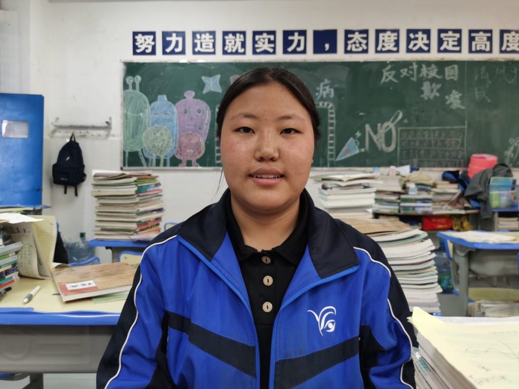 Student smiling in classroom