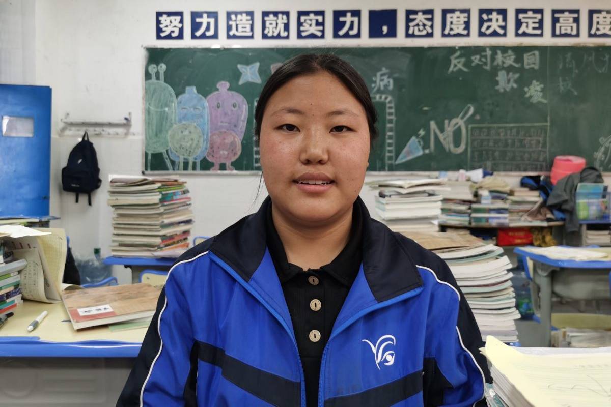 Student smiling in classroom