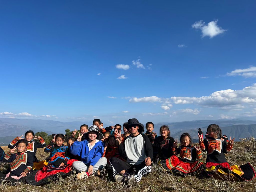 teacher with her students on the mountains