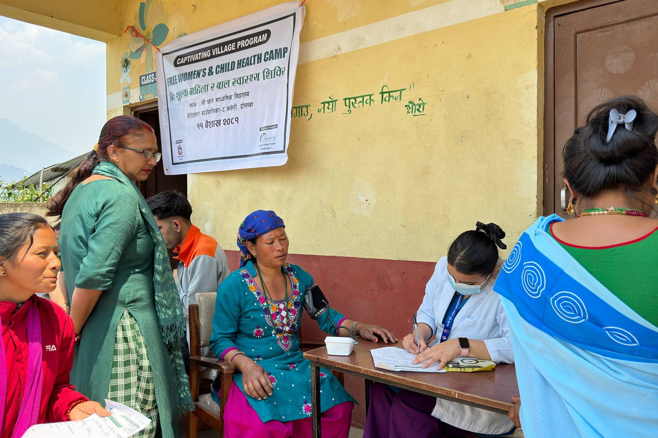 woman getting her blood pressure checked