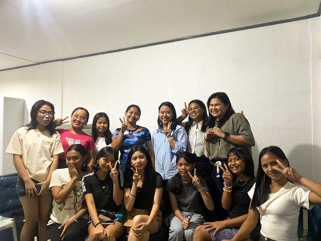 Filipino women and teenage girls posing for a photo