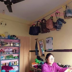 Til Maya Bhujel sitting in her shop at Pokhara