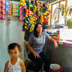 Woman and her toddler in her store 