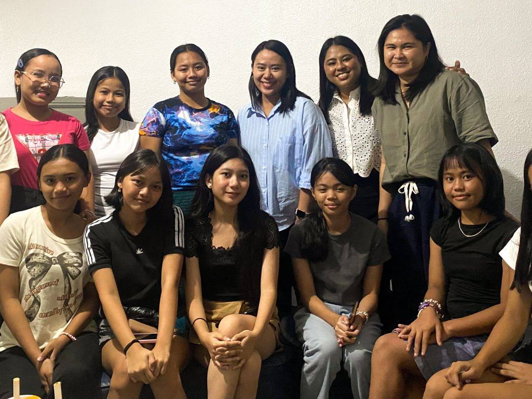 Filipino women and teenage girls posing for a photo