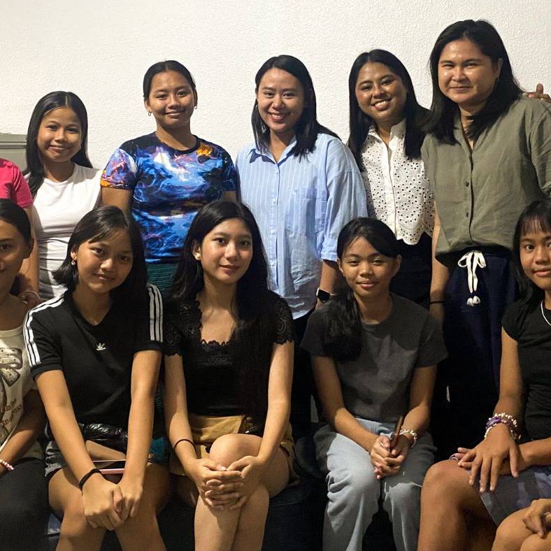 Filipino women and teenage girls posing for a photo