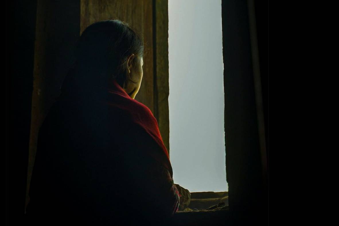 Woman looking out a window