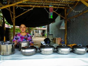 Filipino woman manning a food stand