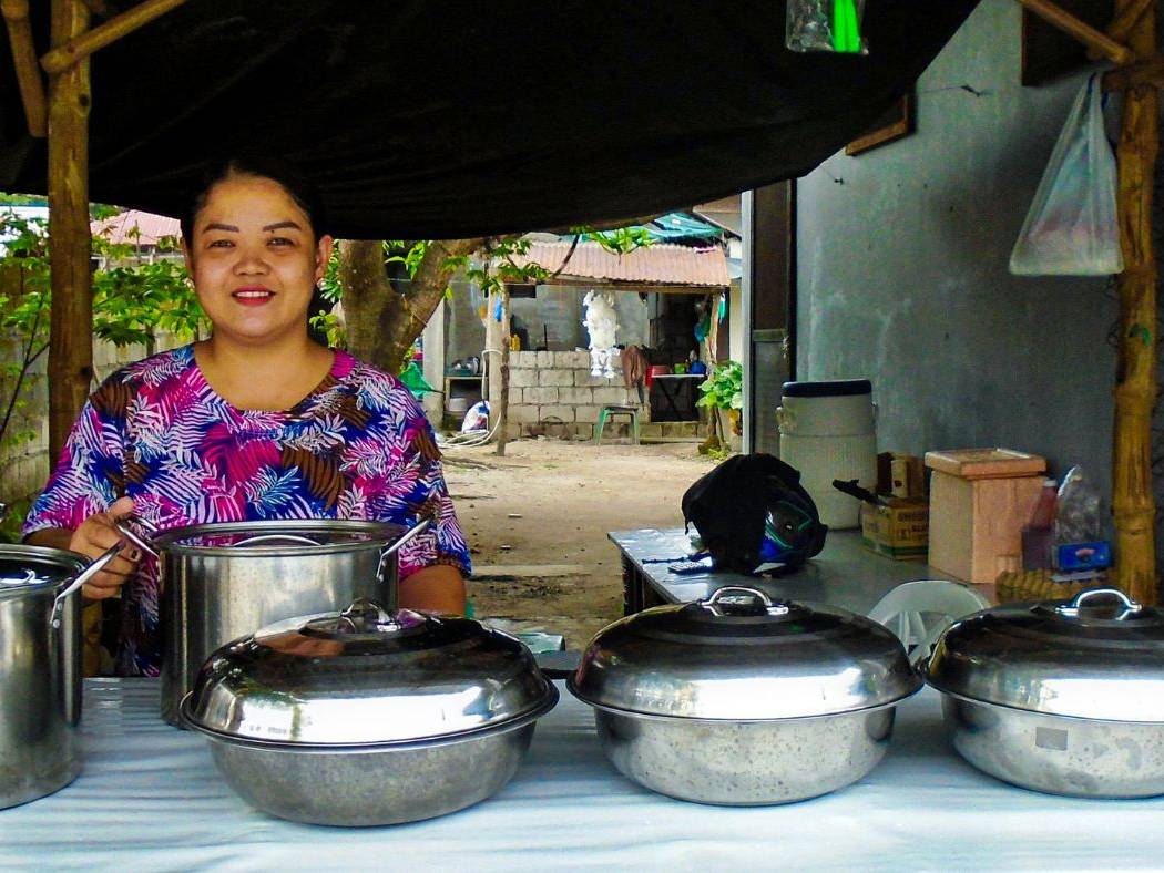 Filipino woman manning a food stand