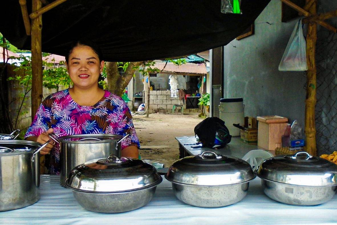 Filipino woman manning a food stand