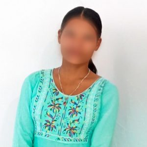 Woman with faced blurred for privacy