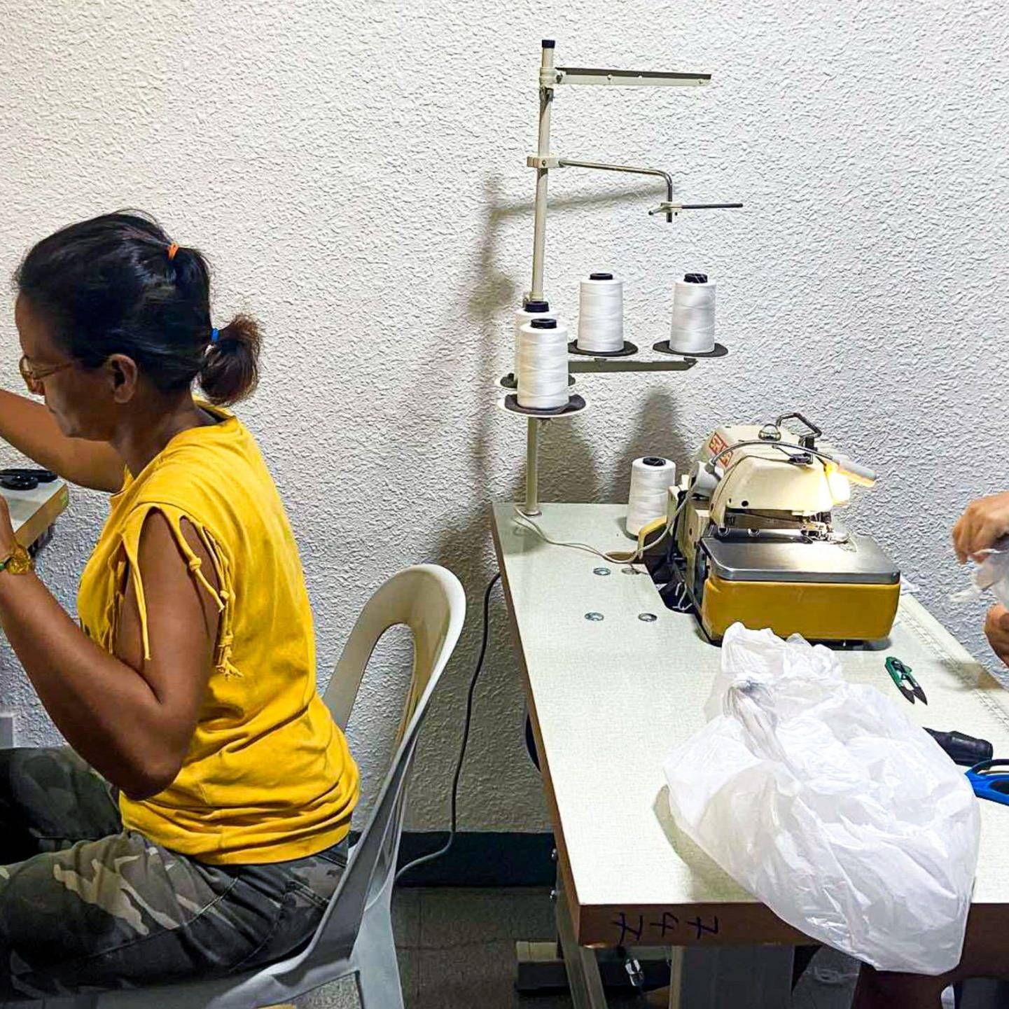 Two Filipino women sewing