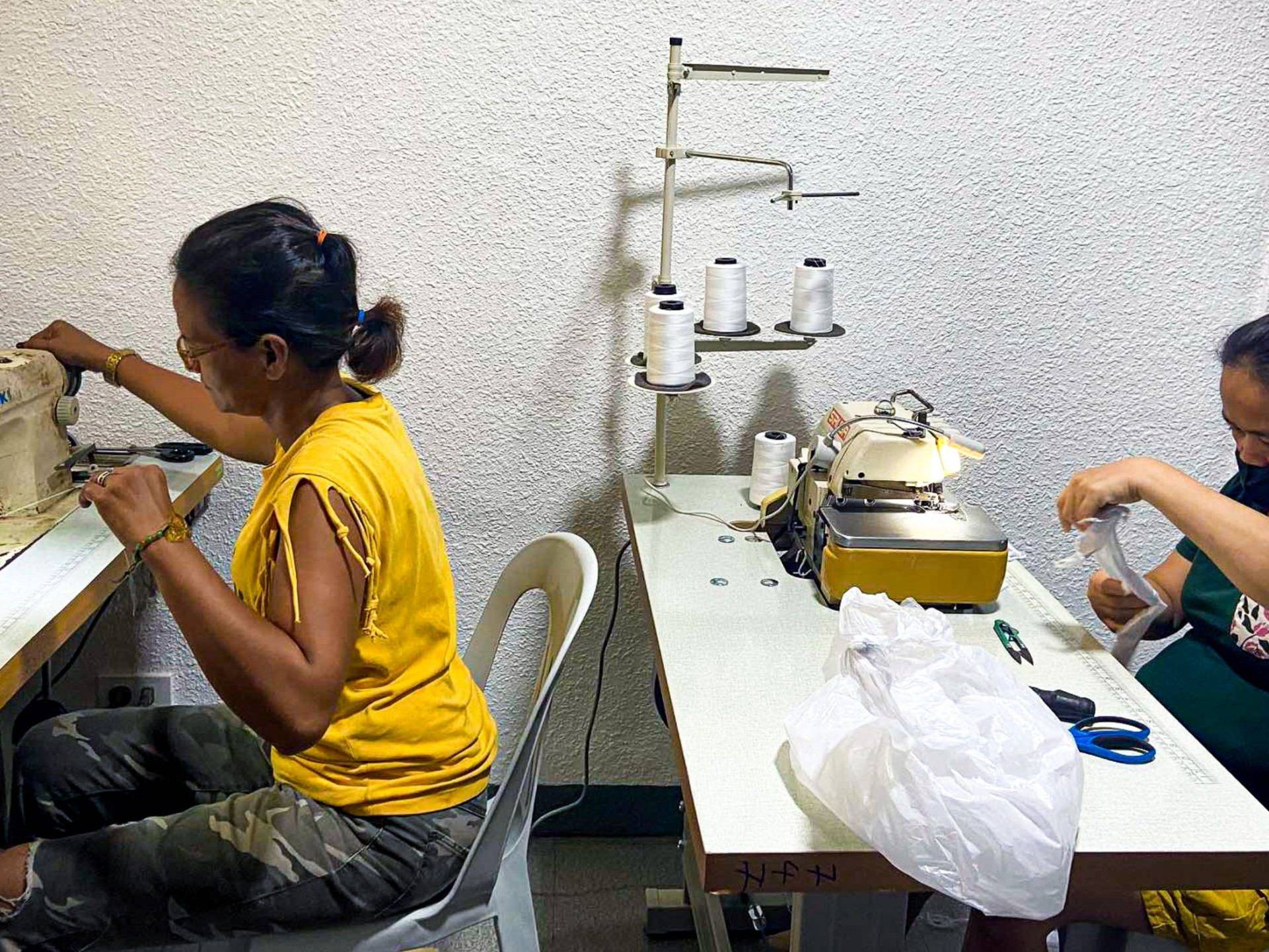 Two Filipino women sewing