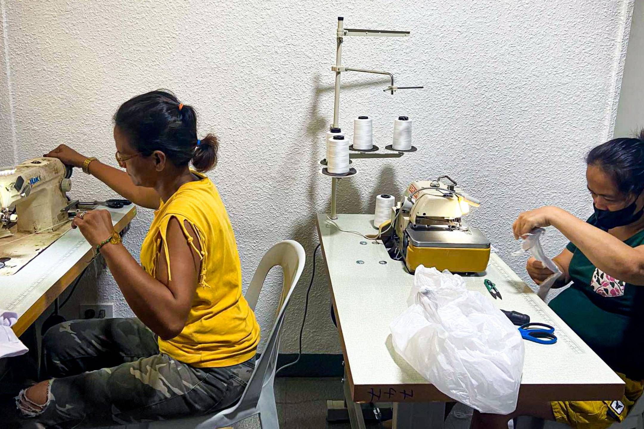 Two Filipino women sewing