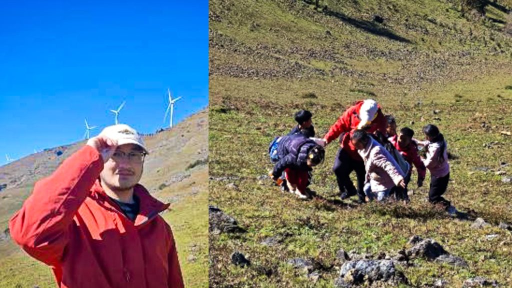 A male teacher outdoors, guiding students on an educational hike.