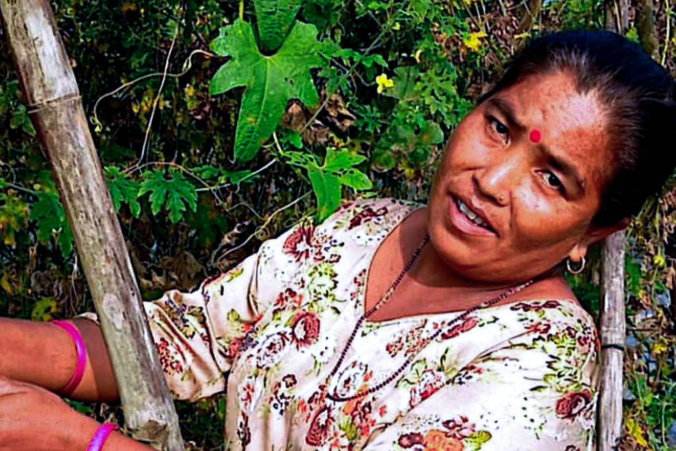 A woman harvesting fresh produce from her vegetable farm.