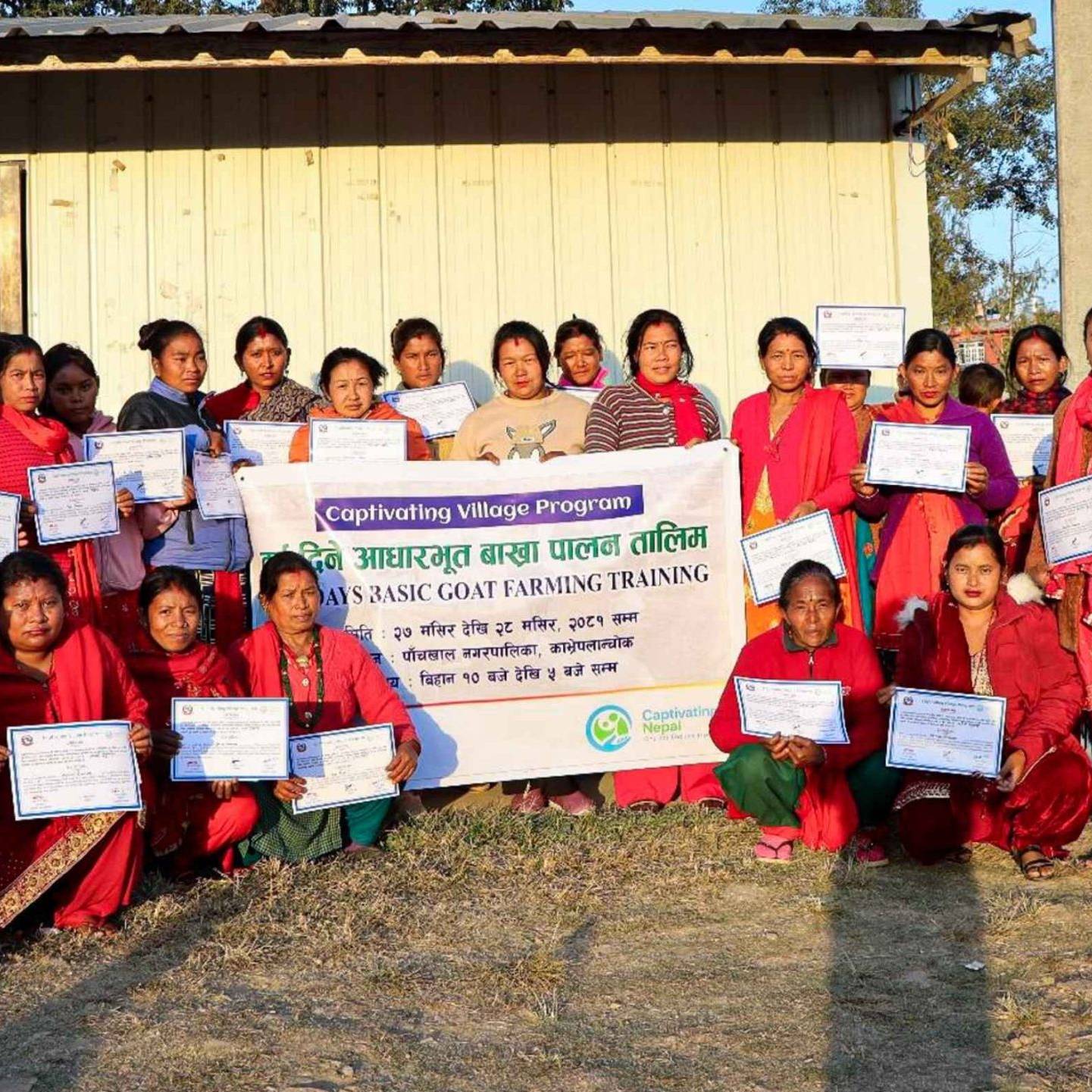 A group of people proudly displaying certificates in front of a building, celebrating their achievements together.