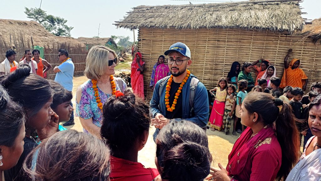 Julie and Captivating Nepal Program Manager Sagar speaking with children at one of our CVP sites.