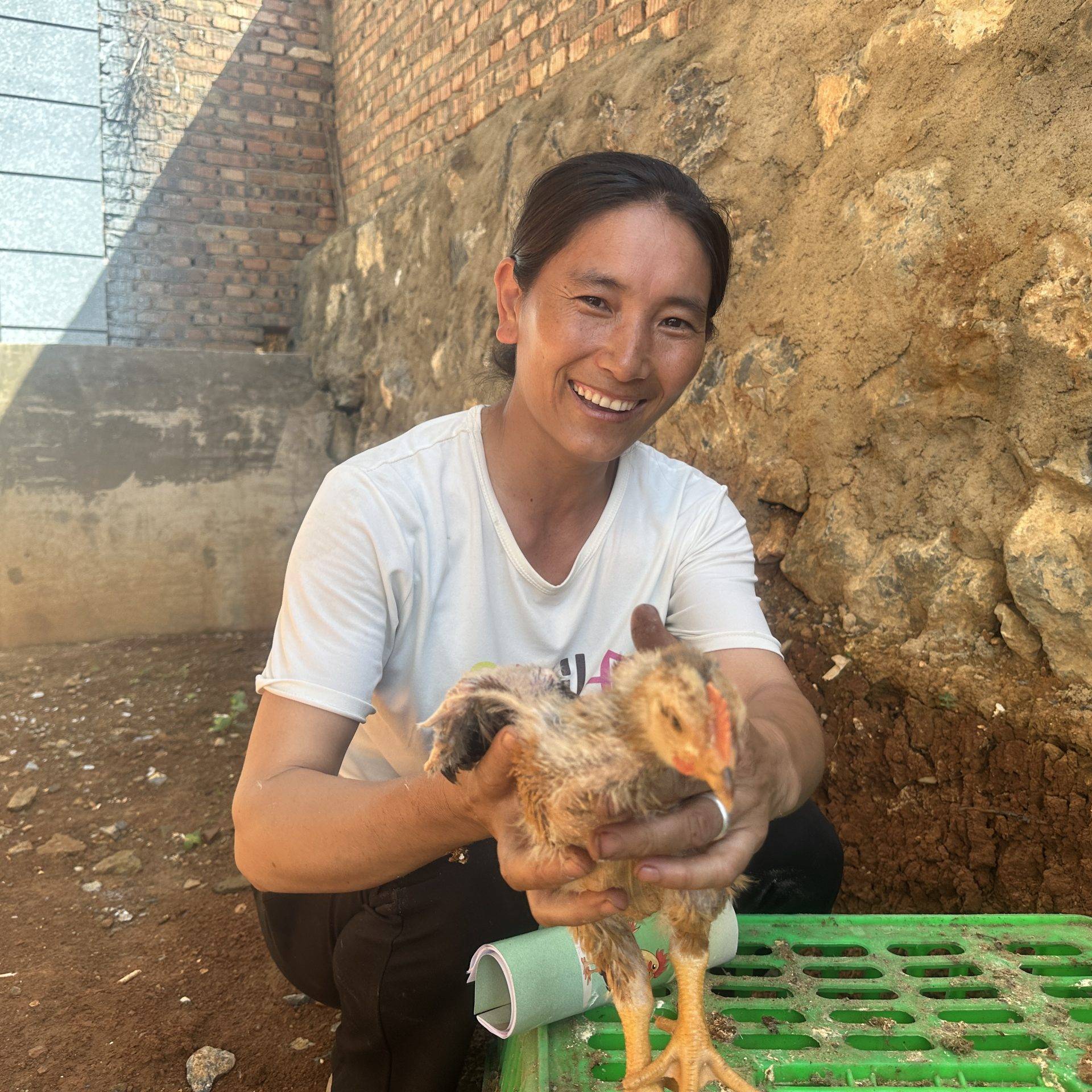 Woman holding chicken