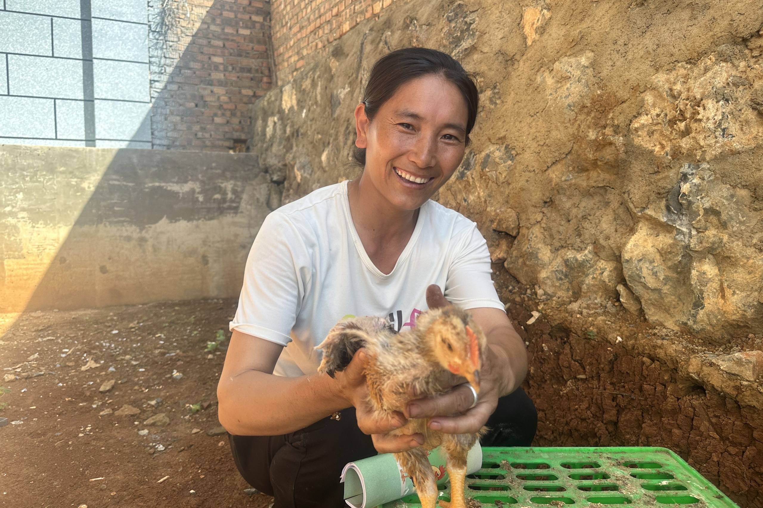 Woman holding chicken