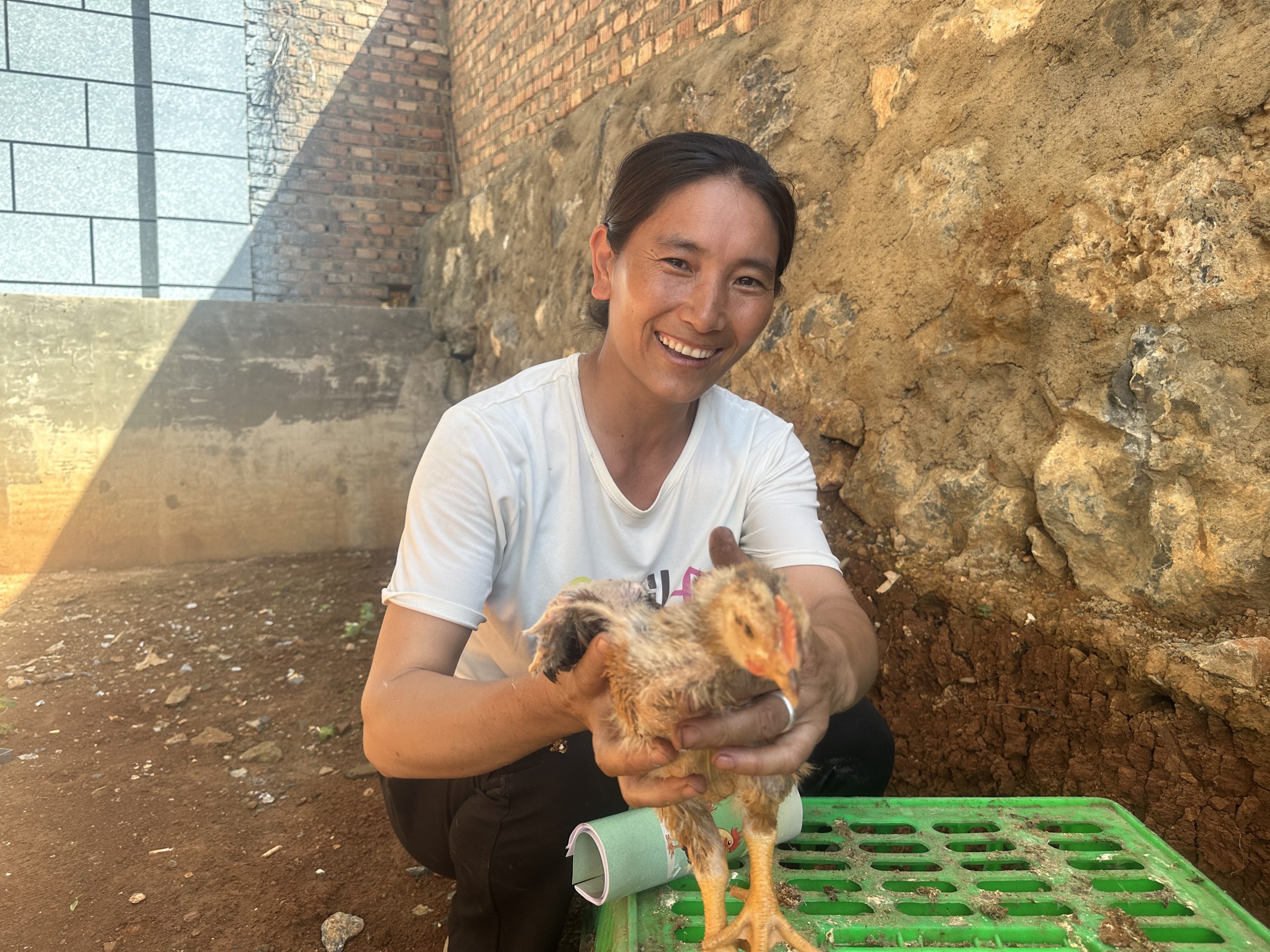 Woman holding chicken