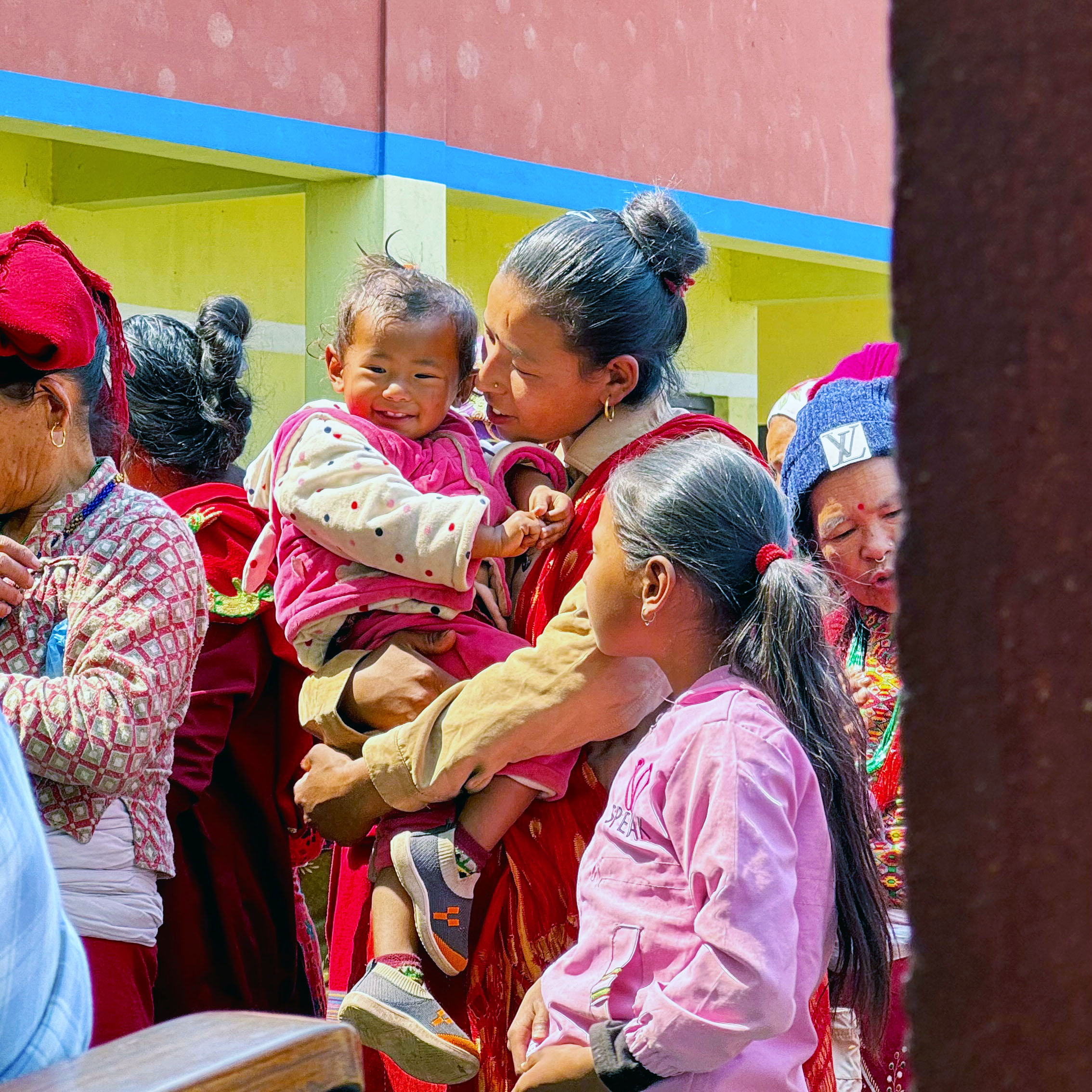 Mother carrying her child