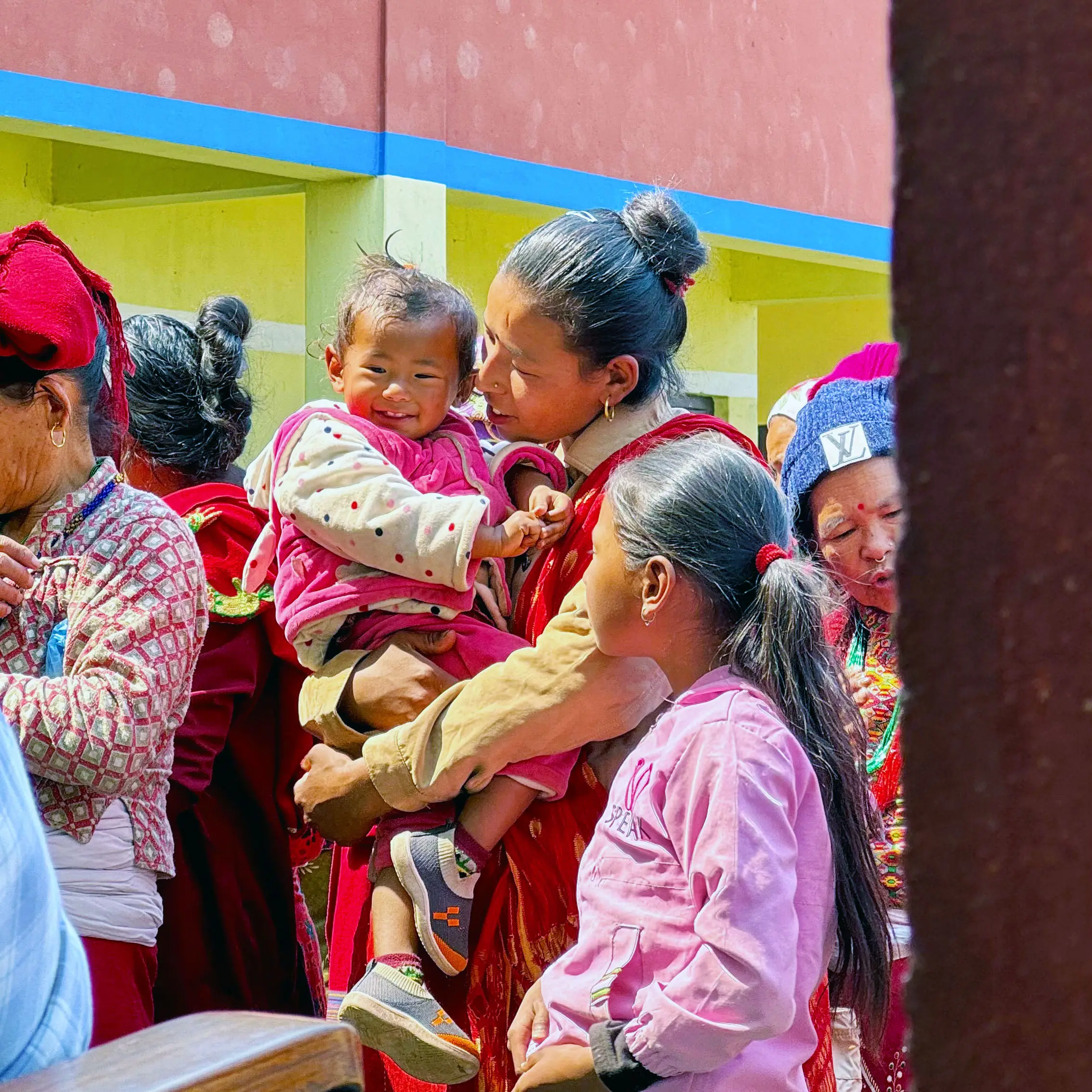 Mother carrying her child