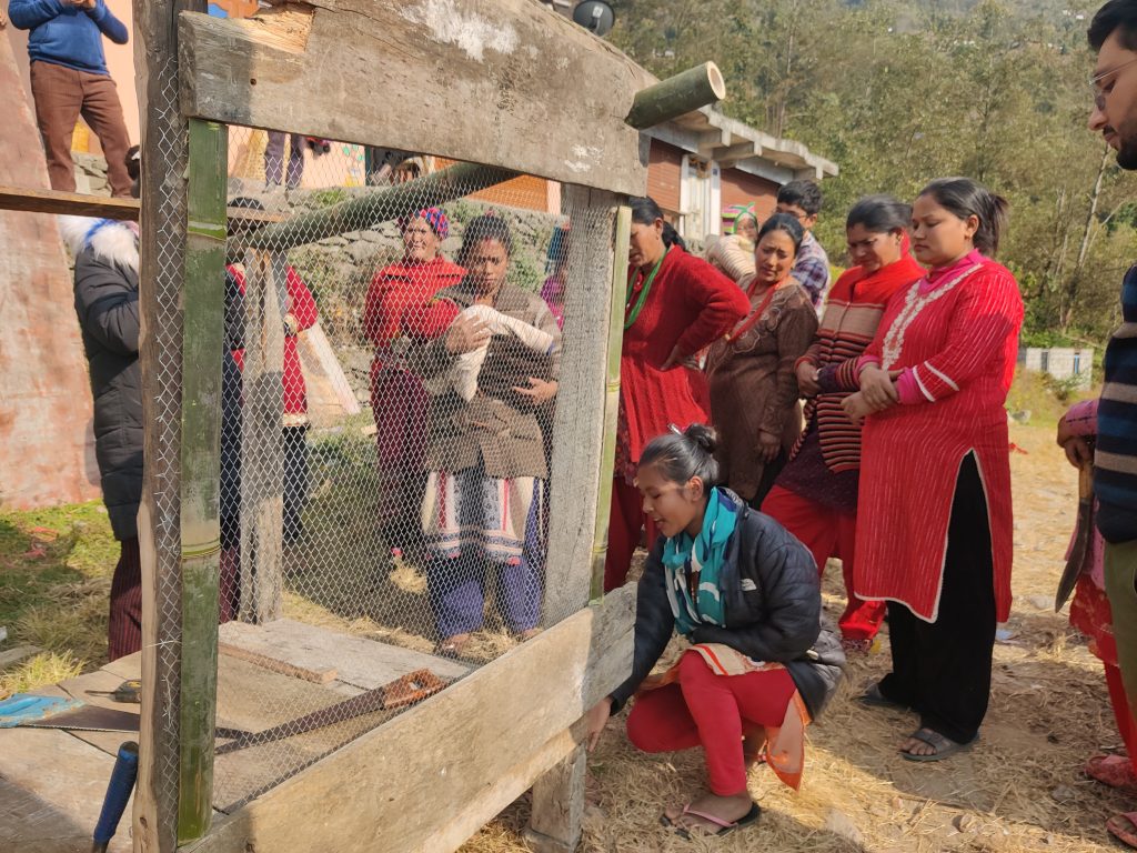Women checking the chicken cages