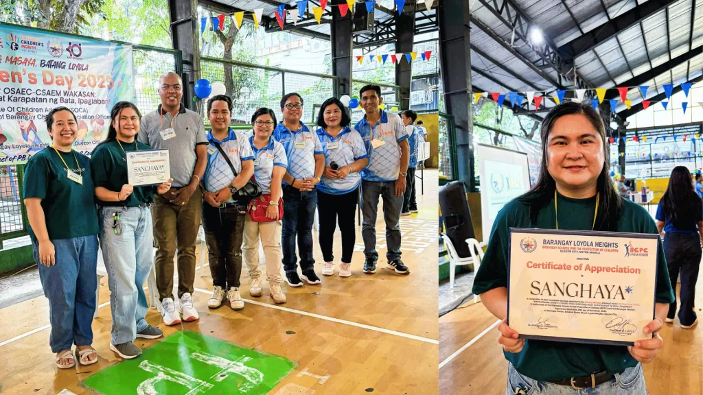 Several individuals gather in front of a basketball court, sharing laughter and conversation in a lively atmosphere.