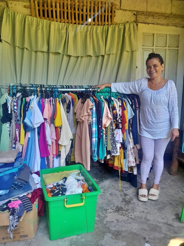 Woman shows her thrift store items for selling