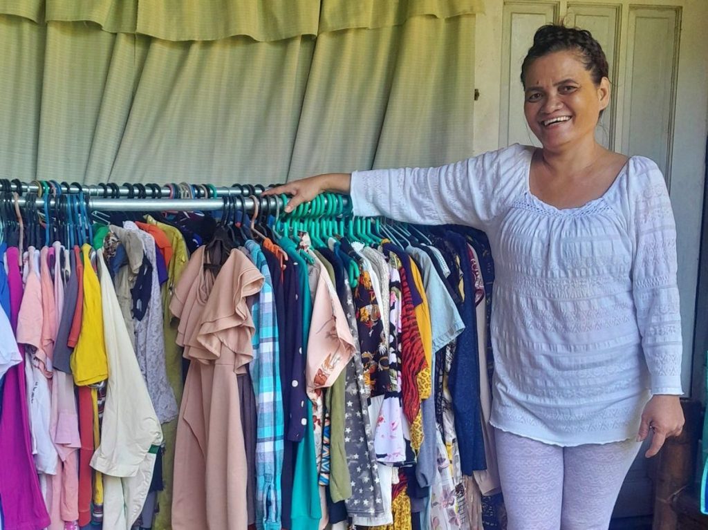 Woman shows her thrift store items for selling