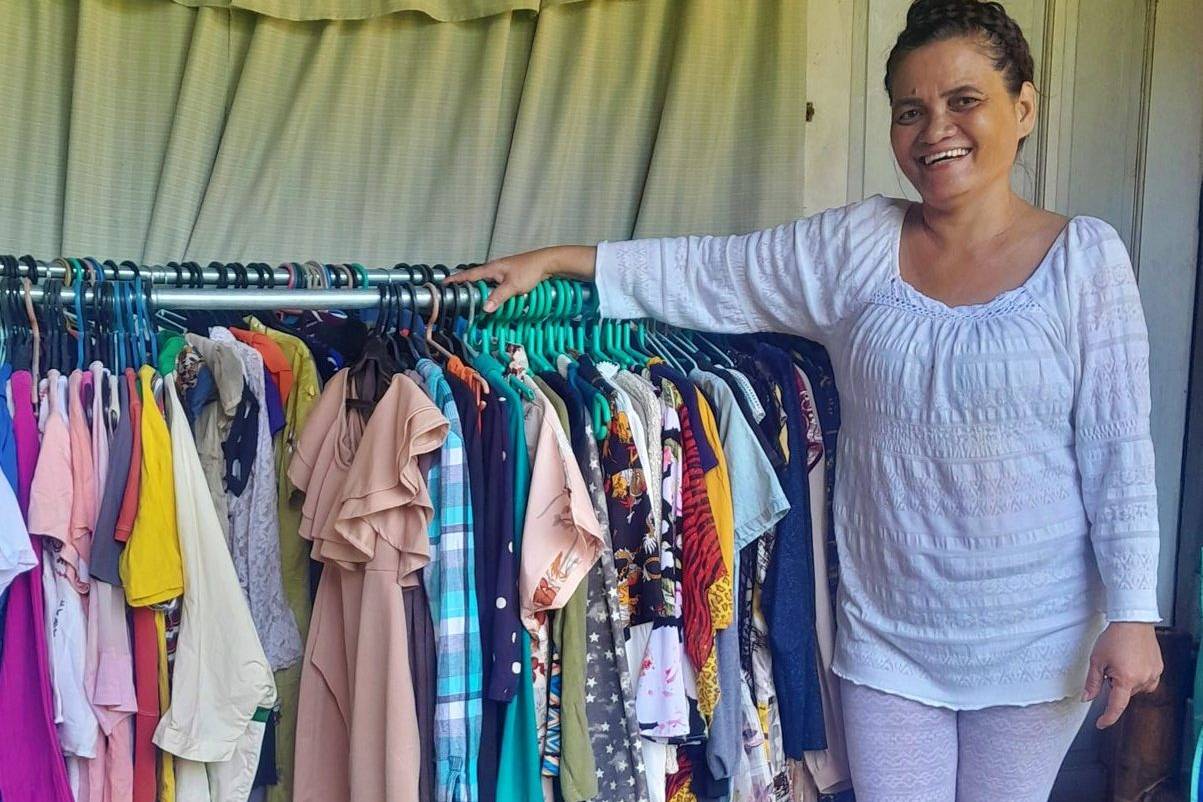 Woman shows her thrift store items for selling