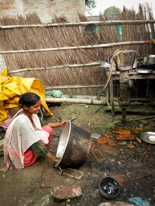 Teenage girl from Nepal washing a basin