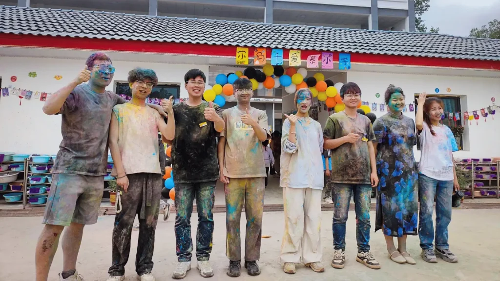 A cheerful group of individuals with vibrant face paint, expressing artistic flair and camaraderie.