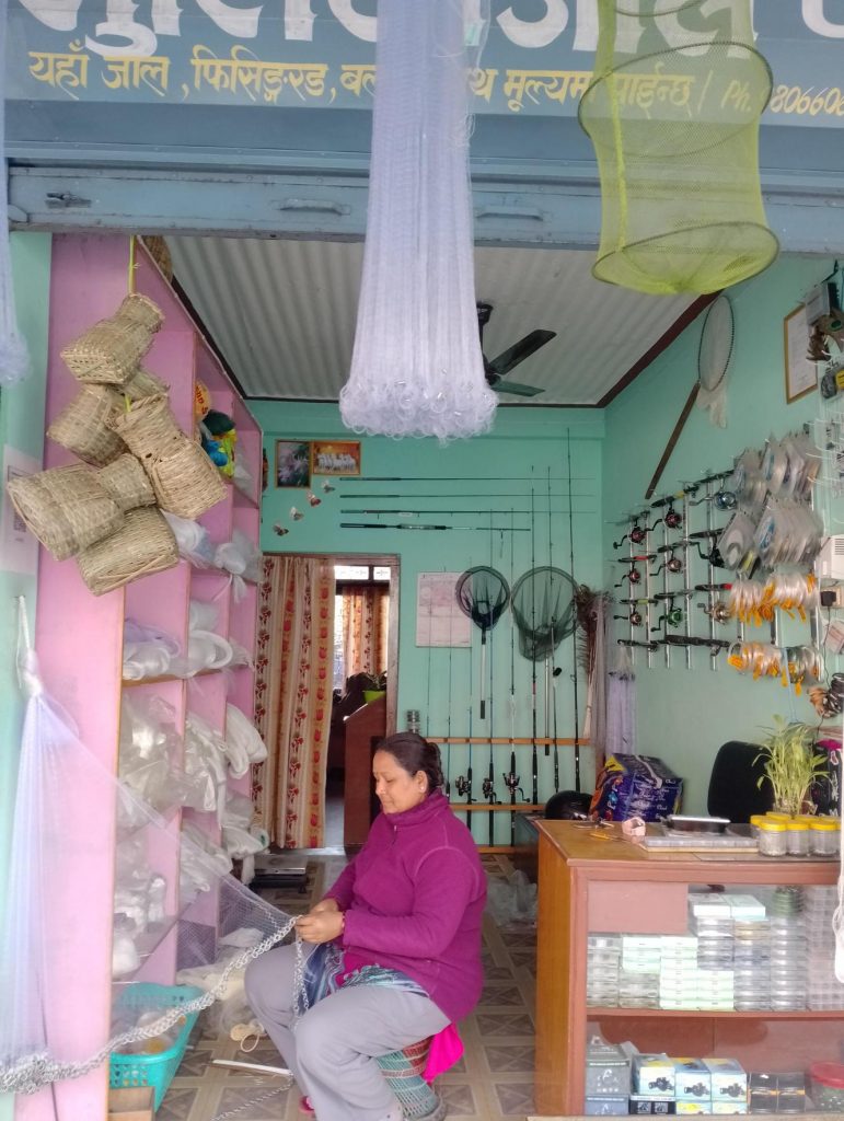 Women working in the fishing equipment store