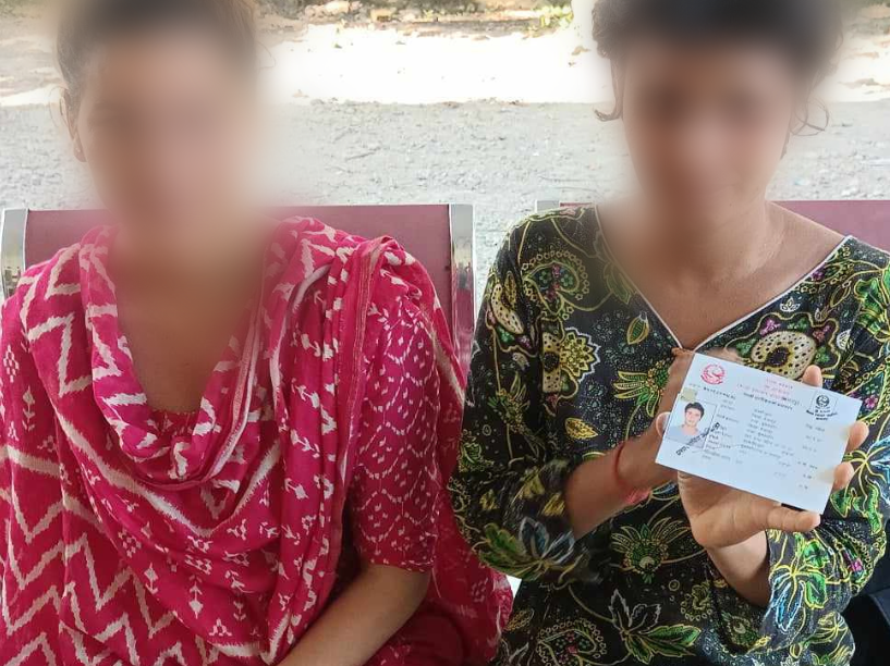 Woman Holds Up Citizenship Card