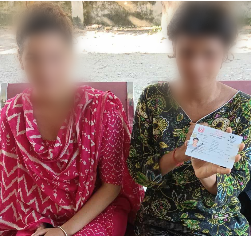 Woman Holds Up Citizenship Card