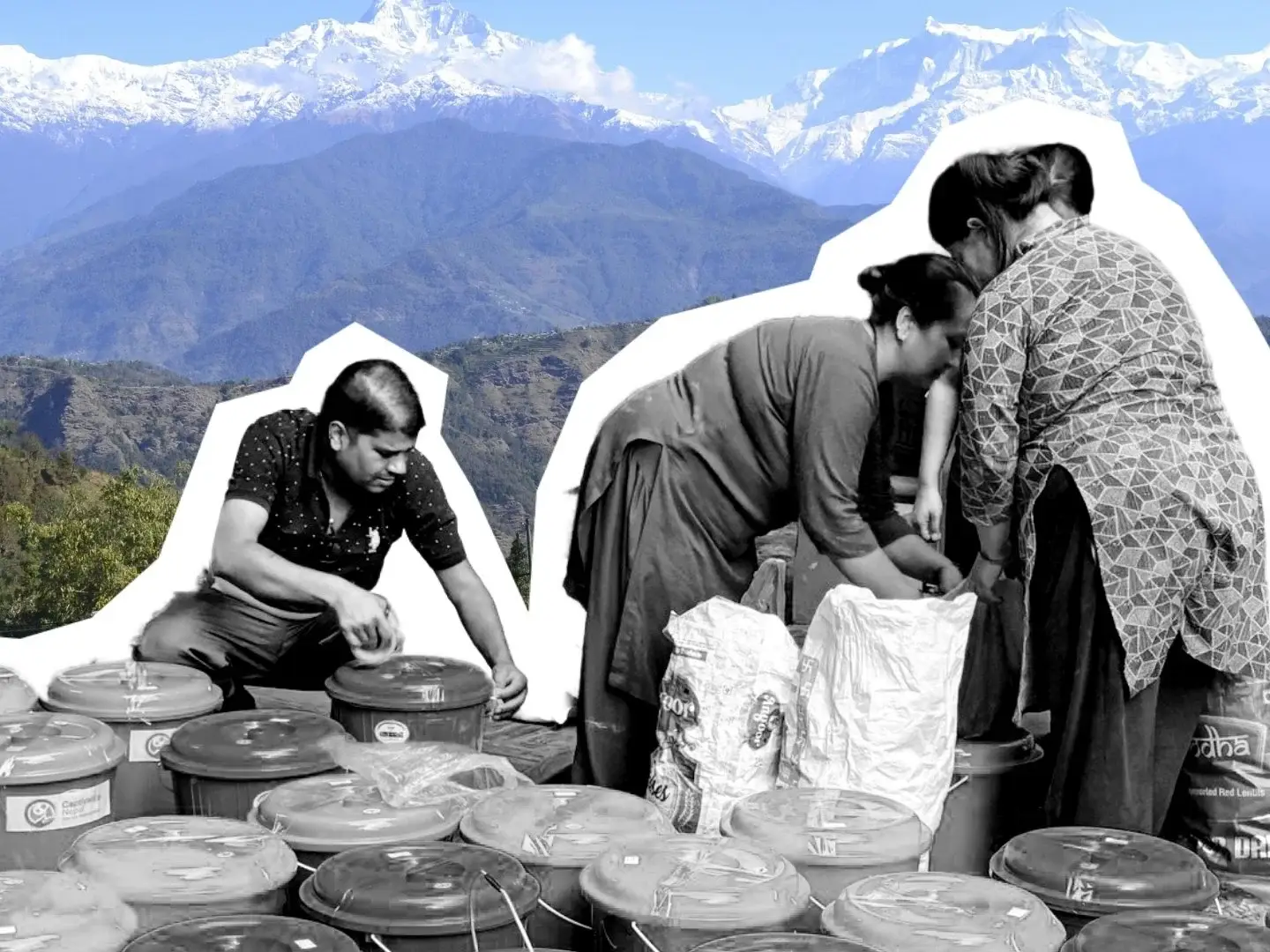 A man and two women work with many plastic containers and sacks against a backdrop of snow-capped mountain peaks in a bright, outdoor setting.